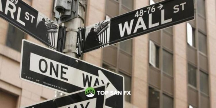 Phố Wall kết thúc cao, Fed chấm dứt việc mua trái phiếu vào tháng 3
